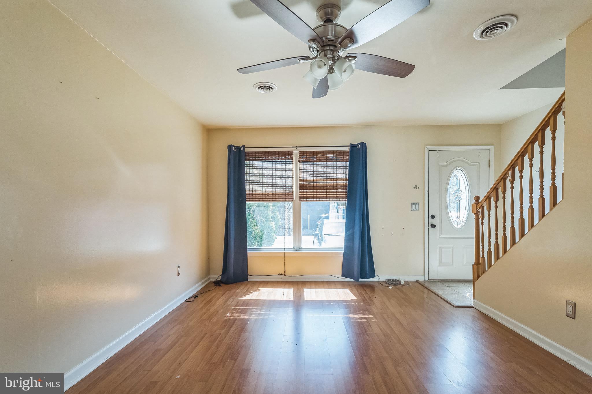 3566 Edgemont Street Philadelphia, PA 19134 - Photo 4 of 25 wooden floor in an empty room with a window