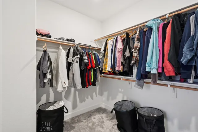 a spacious bathroom with a tub sink and mirror