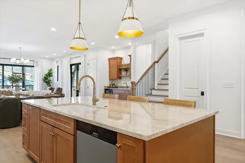 a view of a dining room with furniture large windows and wooden floor