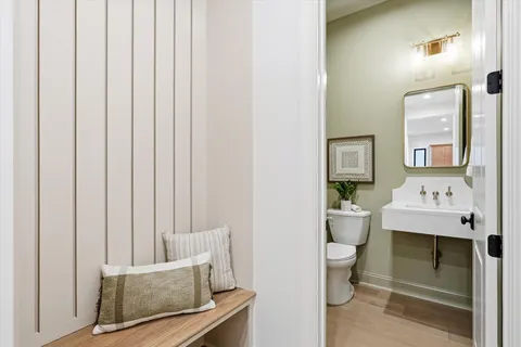 a spacious bathroom with a granite countertop sink and a mirror
