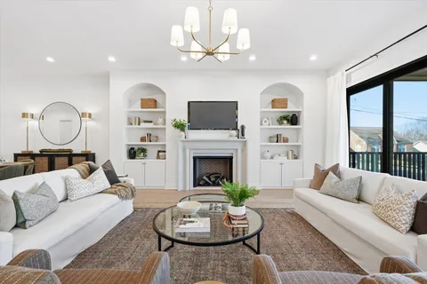 a view of a porch with wooden floor and iron stairs