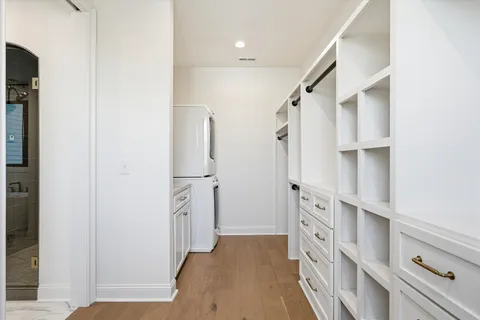 a utility room with sink dryer and washer