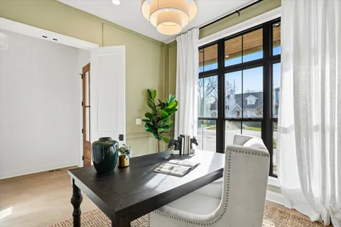 a large kitchen with kitchen island a island a sink a counter space and stainless steel appliances