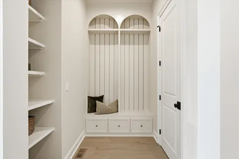 a kitchen with a sink stove and cabinets