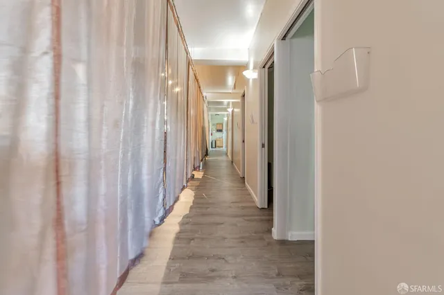 a living room with furniture and windows