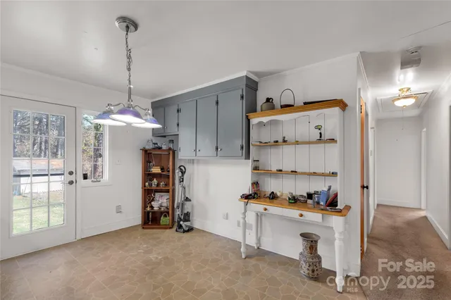 a kitchen that has a lot of cabinets and appliances