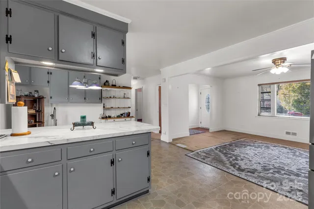 a kitchen with a sink and cabinets