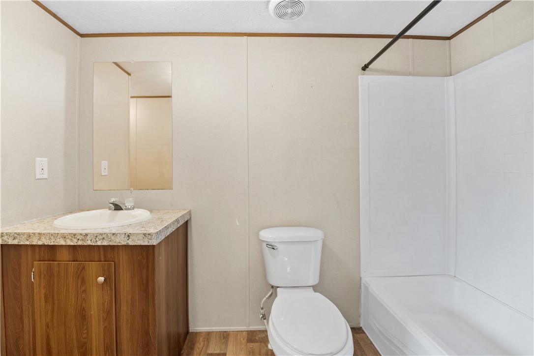 1188 Old Liberty Road Easley, SC 29640 - Photo 20 of 28 This bright bathroom features a functional vanity and a clean bathtub, offering essential comfort.