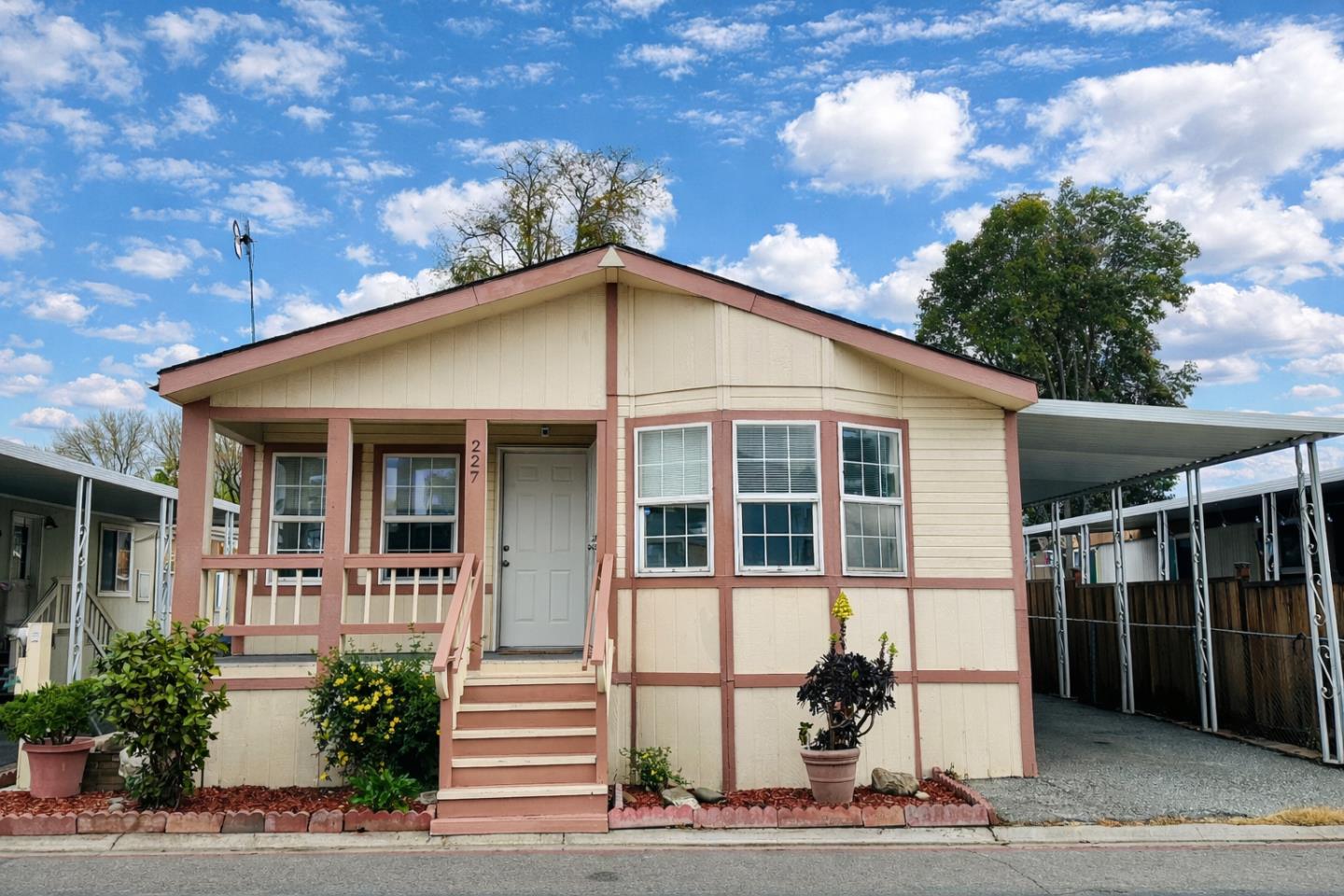 200 Ford Road, Unit 227 San Jose, CA 95138 - Photo 1 of 27 a front view of a house with a yard