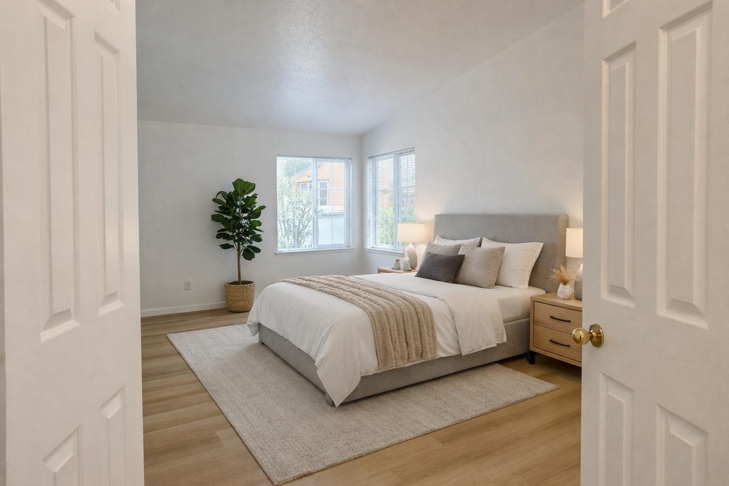 200 Ford Road, Unit 227 San Jose, CA 95138 - Photo 21 of 27 a bedroom with a large bed and windows