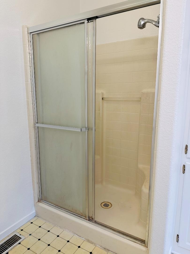 200 Ford Road, Unit 227 San Jose, CA 95138 - Photo 26 of 27 a bathroom with a glass shower door