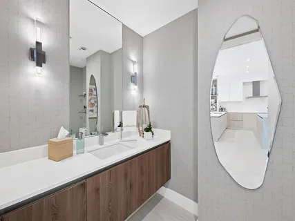 a en suite bathroom with a sink and mirror