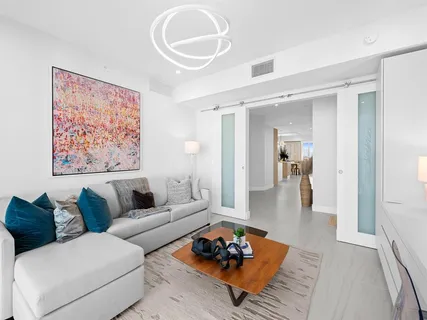 a living room with furniture and a rug