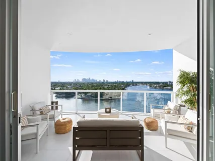 a bed room with a bed and a balcony