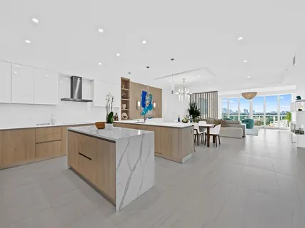 a kitchen with lots of counter top space and living room
