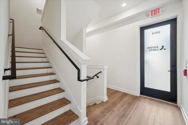 a view of entryway with wooden floor