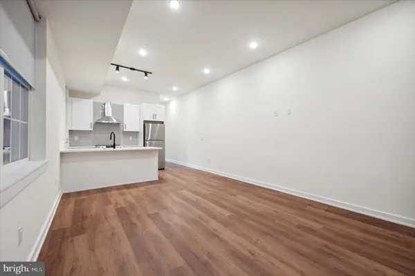a view of kitchen with wooden floor