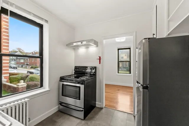a kitchen with a stove and a refrigerator