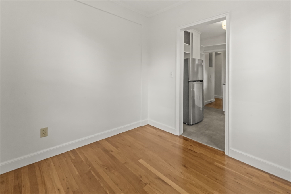 38-40 Cedar Street, Unit 141 Worcester, MA 01609 - Photo 18 of 26 a view of a small space with wooden floor and a hallway