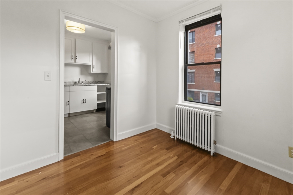 38-40 Cedar Street, Unit 141 Worcester, MA 01609 - Photo 19 of 26 a view of a kitchen with wooden floor and a sink