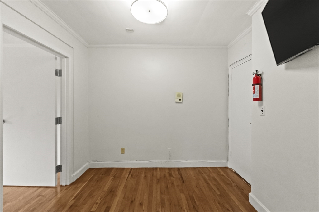 38-40 Cedar Street, Unit 141 Worcester, MA 01609 - Photo 26 of 26 a view of room with wooden floor