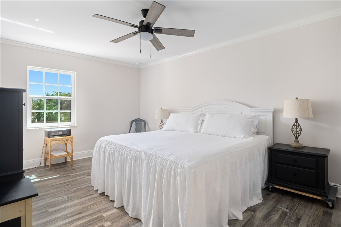 1180 Reef Road, Unit A20 Vero Beach, FL 32963 - Photo 13 of 32 a bedroom with a bed and a window