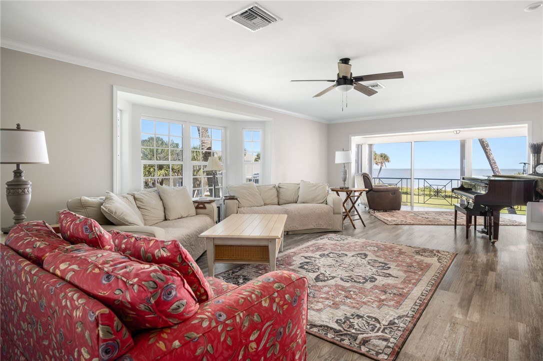 1180 Reef Road, Unit A20 Vero Beach, FL 32963 - Photo 4 of 32 a living room with furniture and a table