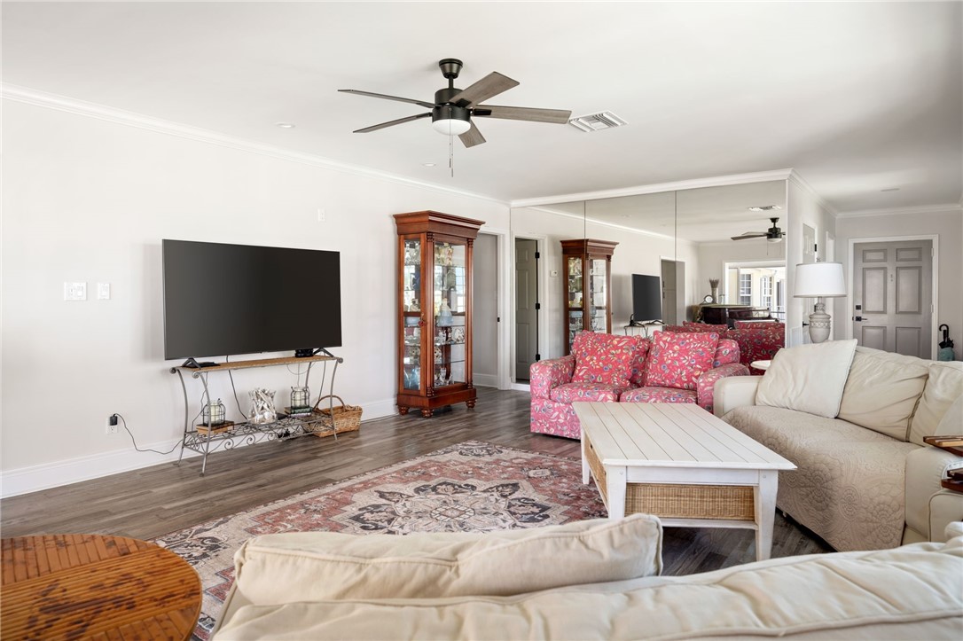 1180 Reef Road, Unit A20 Vero Beach, FL 32963 - Photo 5 of 32 a living room with furniture and a flat screen tv