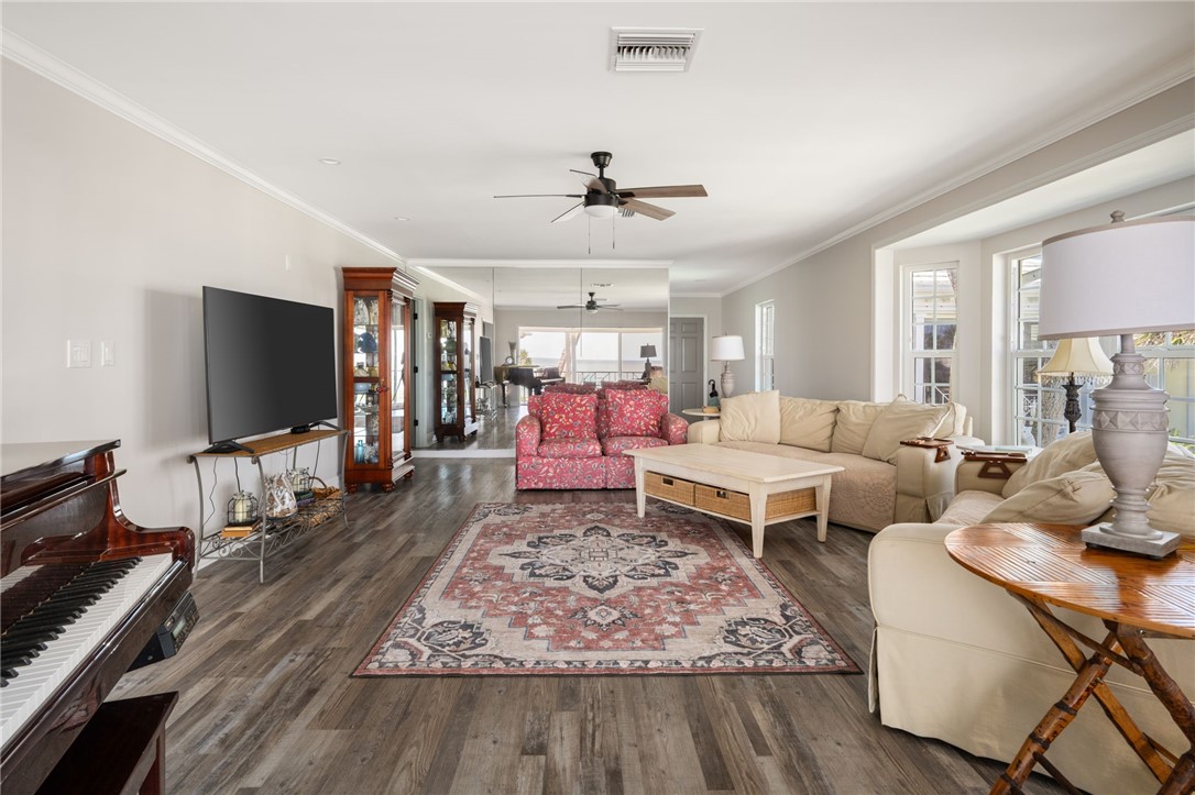 1180 Reef Road, Unit A20 Vero Beach, FL 32963 - Photo 6 of 32 a living room with furniture and a flat screen tv