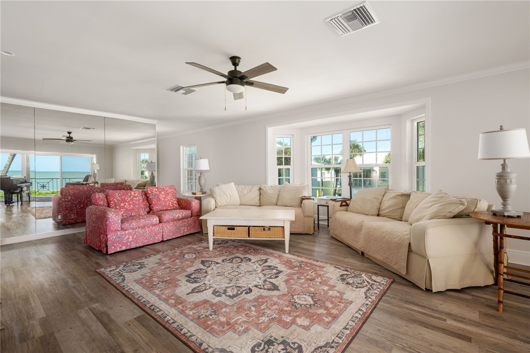 1180 Reef Road, Unit A20 Vero Beach, FL 32963 - Photo 7 of 32 a living room with furniture and a large window