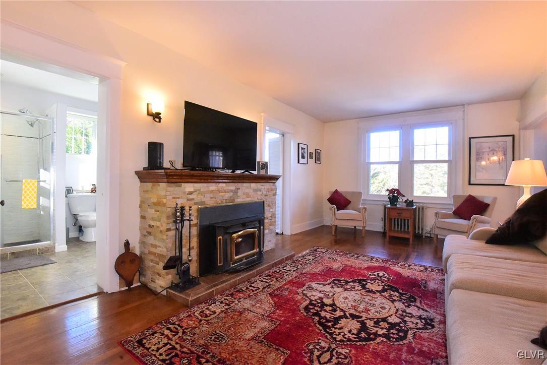 1776 Friedensville Road Hellertown, PA 18055 - Photo 11 of 23 a living room with furniture flat screen tv and a fireplace