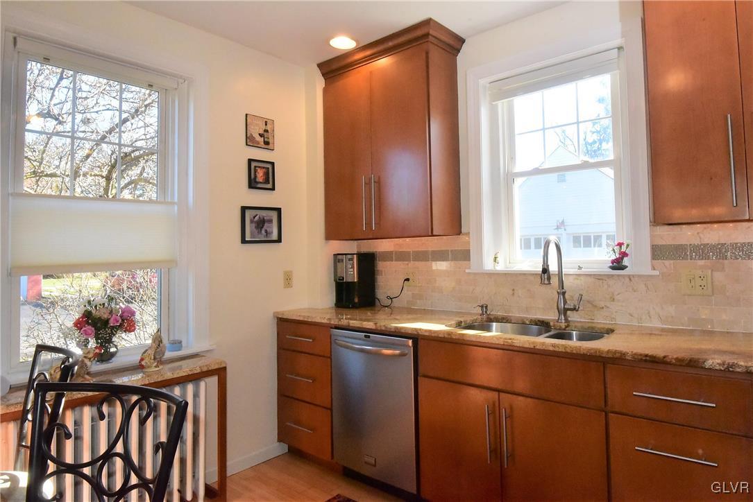 1776 Friedensville Road Hellertown, PA 18055 - Photo 3 of 23 a kitchen with stainless steel appliances granite countertop a sink a stove and a window