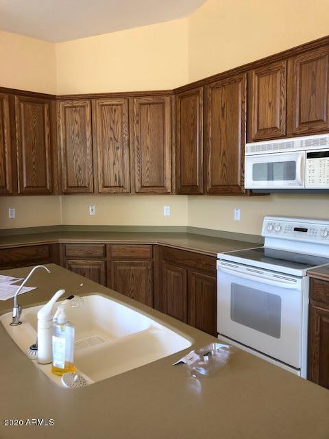 2050 North Piedra Mesa, AZ 85207 - Photo 4 of 10 a kitchen with a sink and cabinets