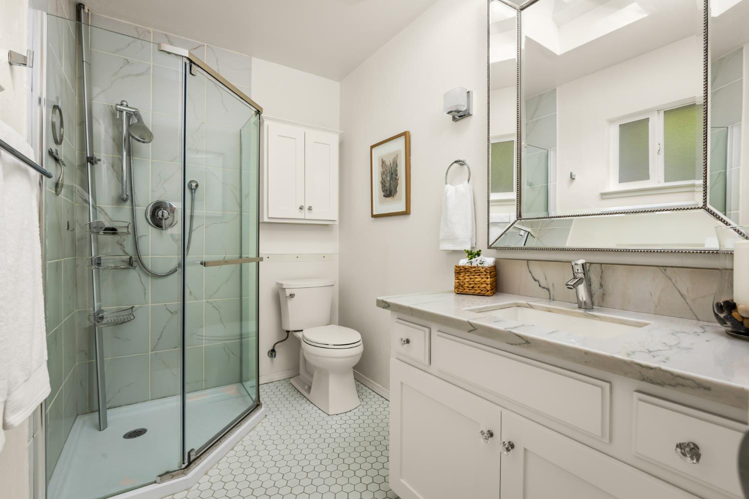 10875 Spenceville Road Penn Valley, CA 95946 - Photo 18 of 49 a bathroom with a granite countertop sink toilet and shower