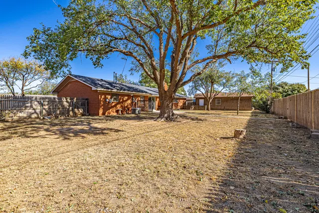 a view of house with snow on the side of the road