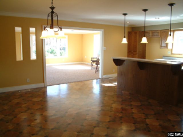 14360 Rancheros Drive Reno, NV 89521 - Photo 3 of 9 a view of a room with wooden floor and windows