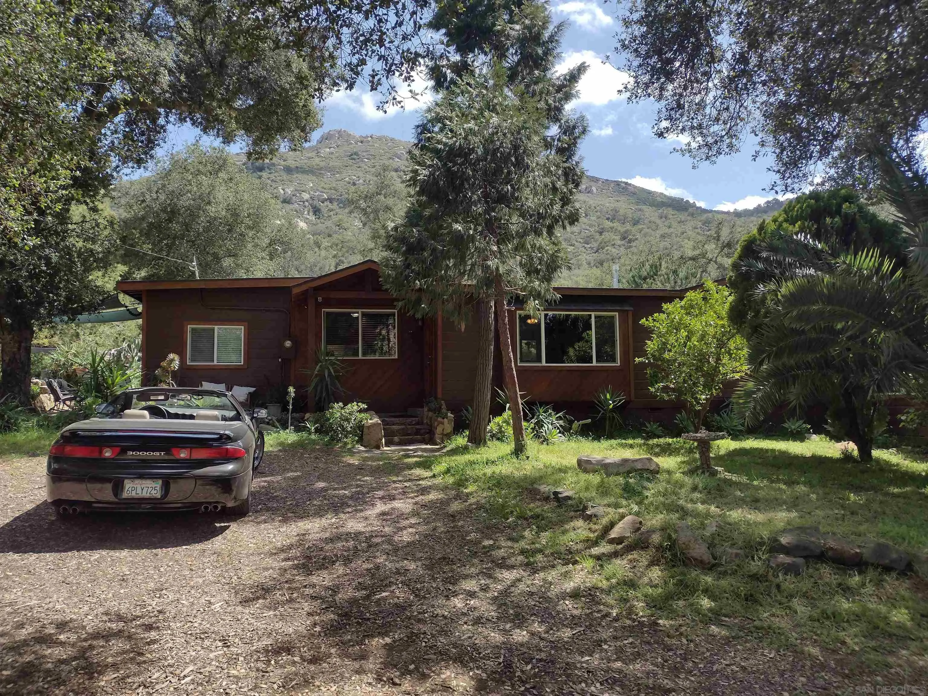 17661 Lyons Valley Road Jamul, CA 91935 - Photo 2 of 50 a house view with a garden space