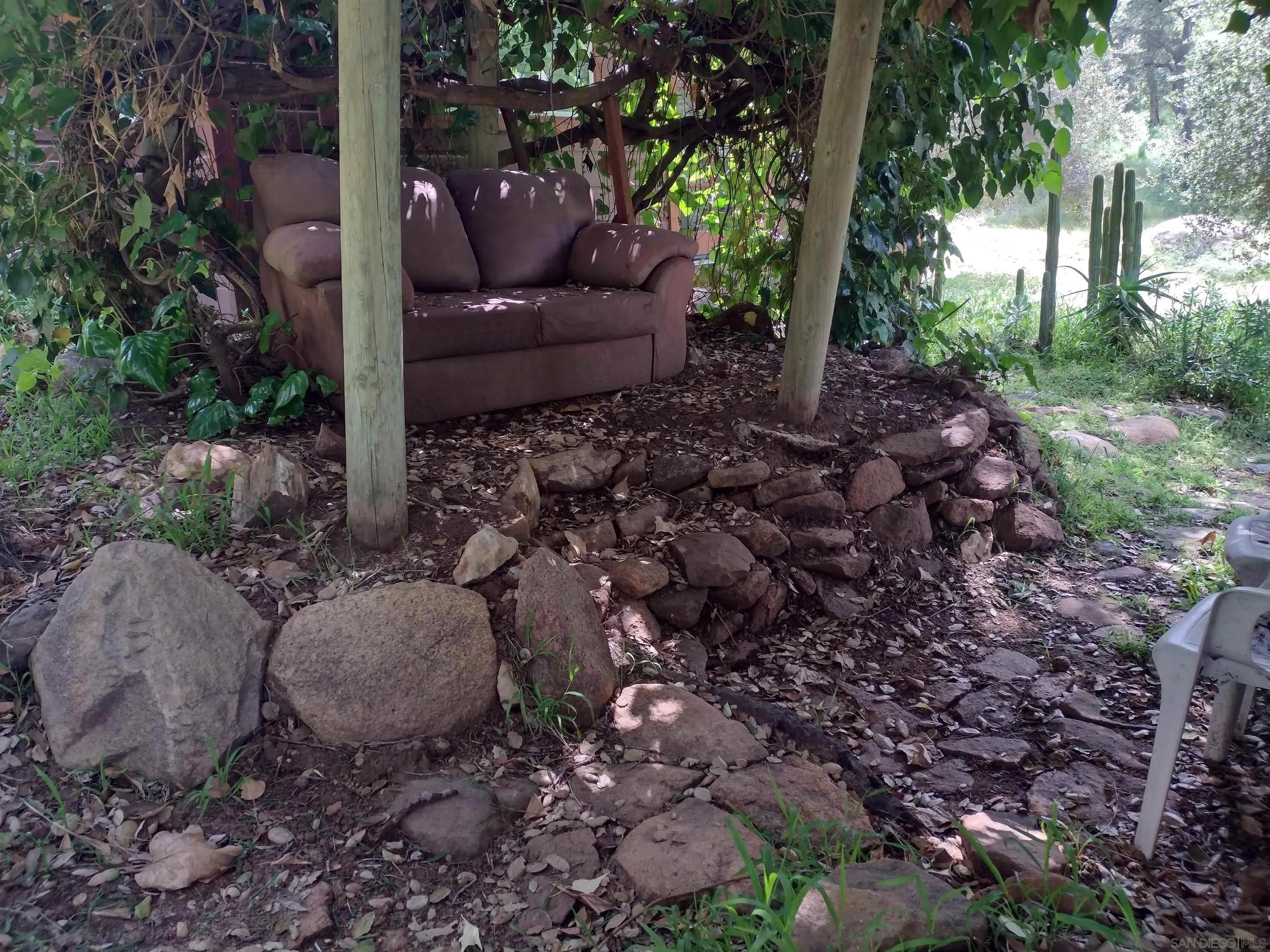 17661 Lyons Valley Road Jamul, CA 91935 - Photo 25 of 50 a view of a backyard with plants and large trees