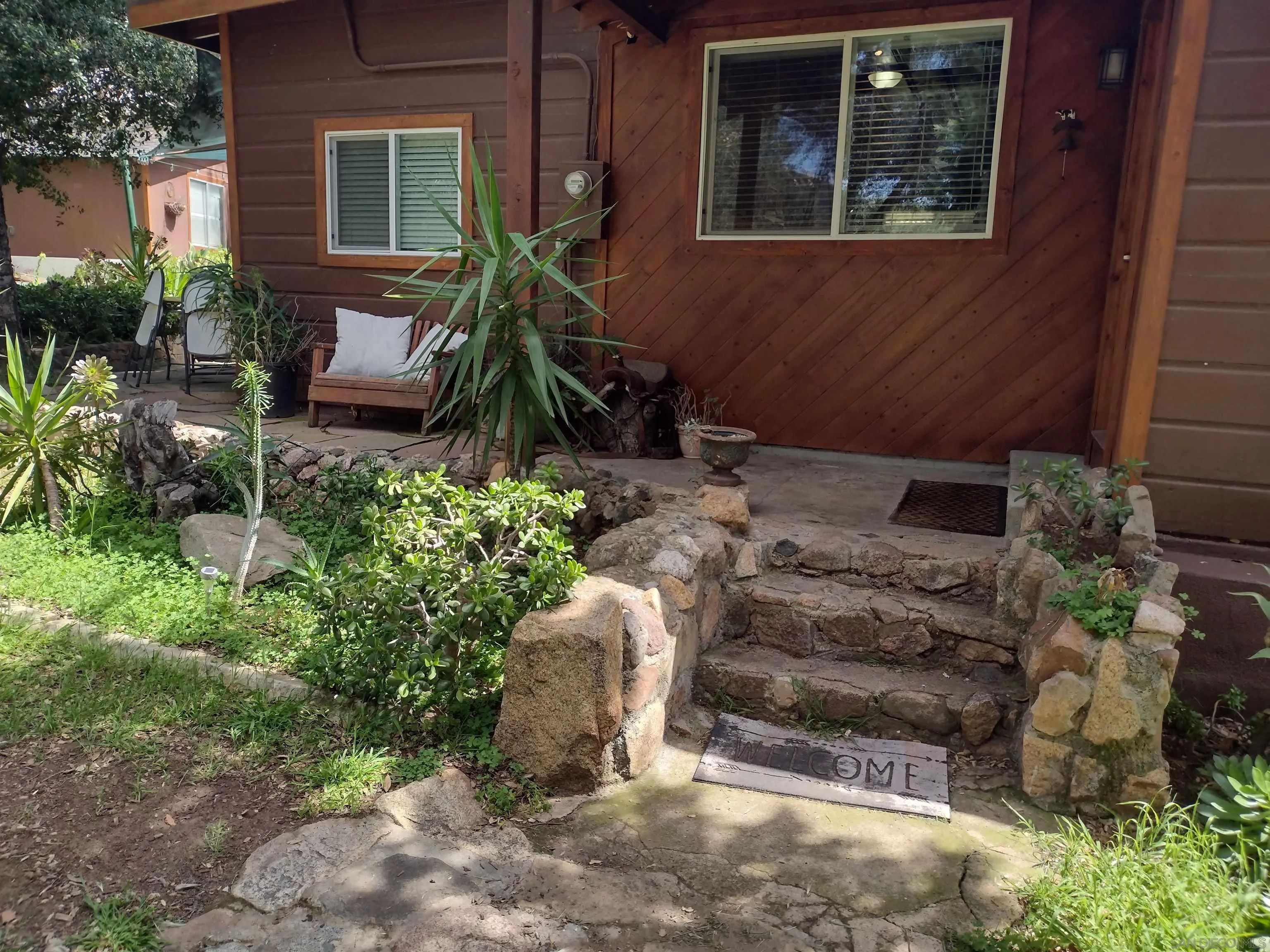17661 Lyons Valley Road Jamul, CA 91935 - Photo 26 of 50 a backyard of a house with yard fire pit and outdoor seating