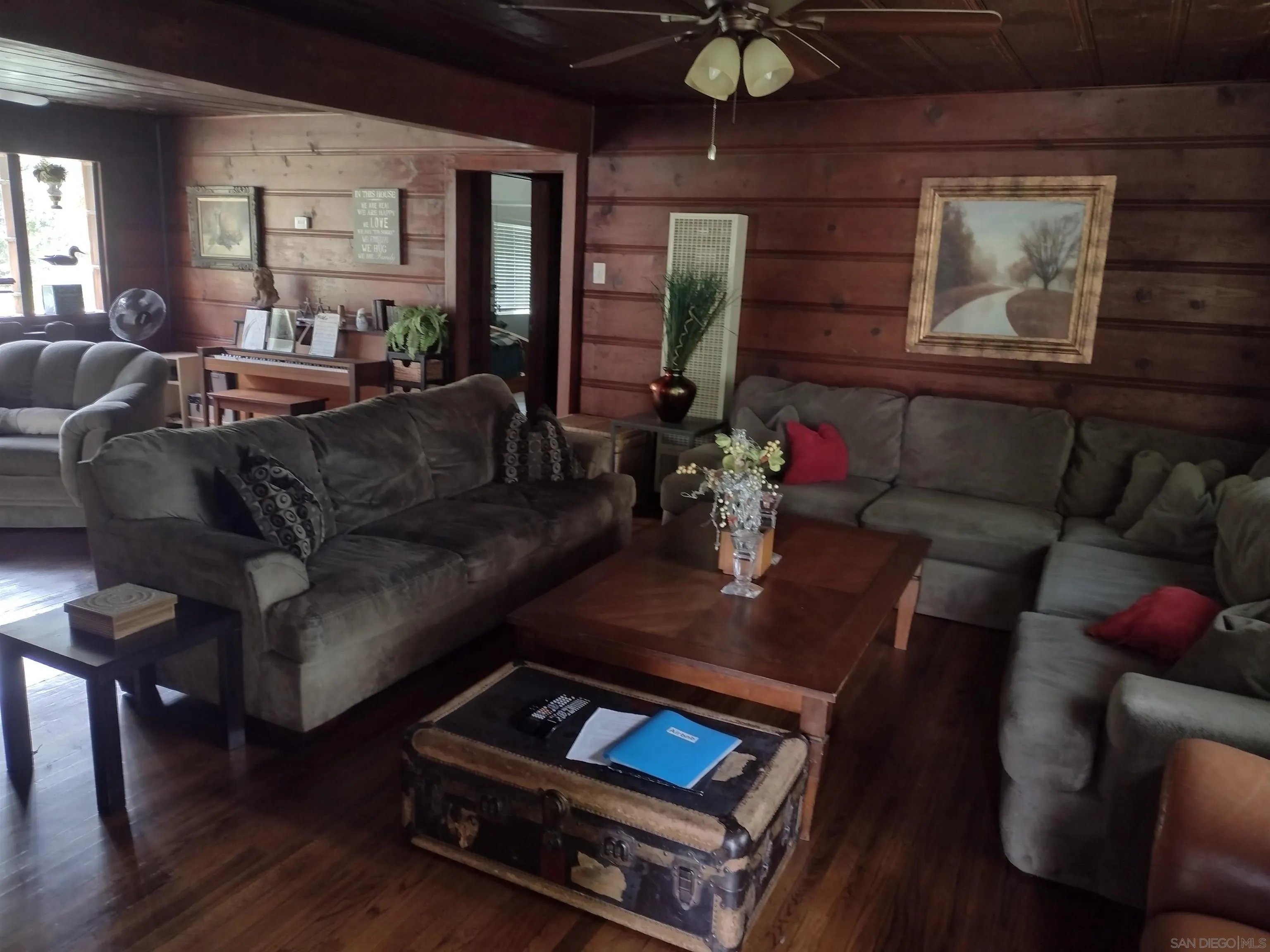 17661 Lyons Valley Road Jamul, CA 91935 - Photo 28 of 50 a living room with furniture and wooden floor
