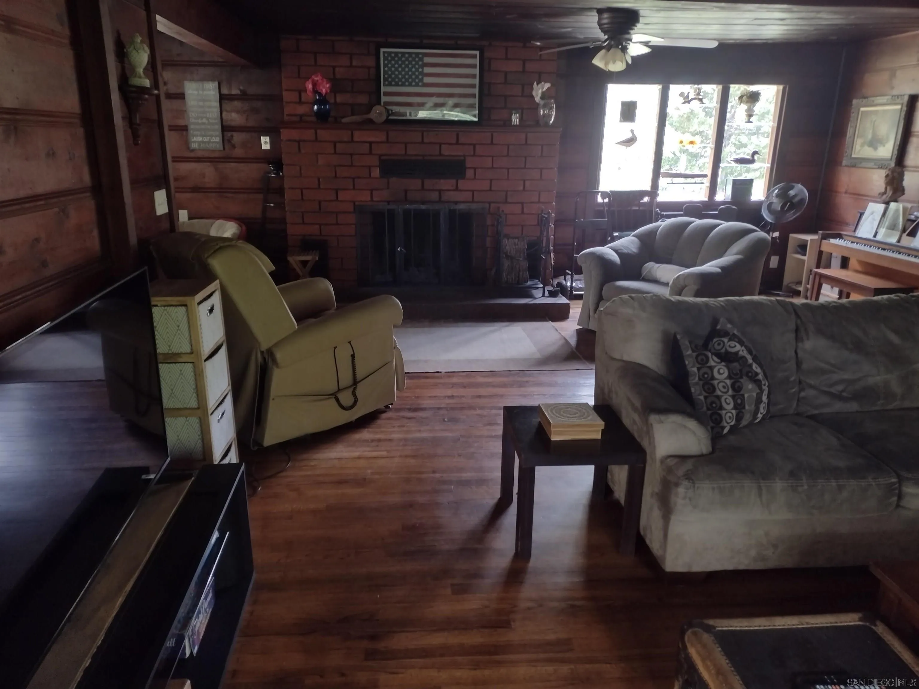 17661 Lyons Valley Road Jamul, CA 91935 - Photo 29 of 50 a living room with furniture and a fireplace