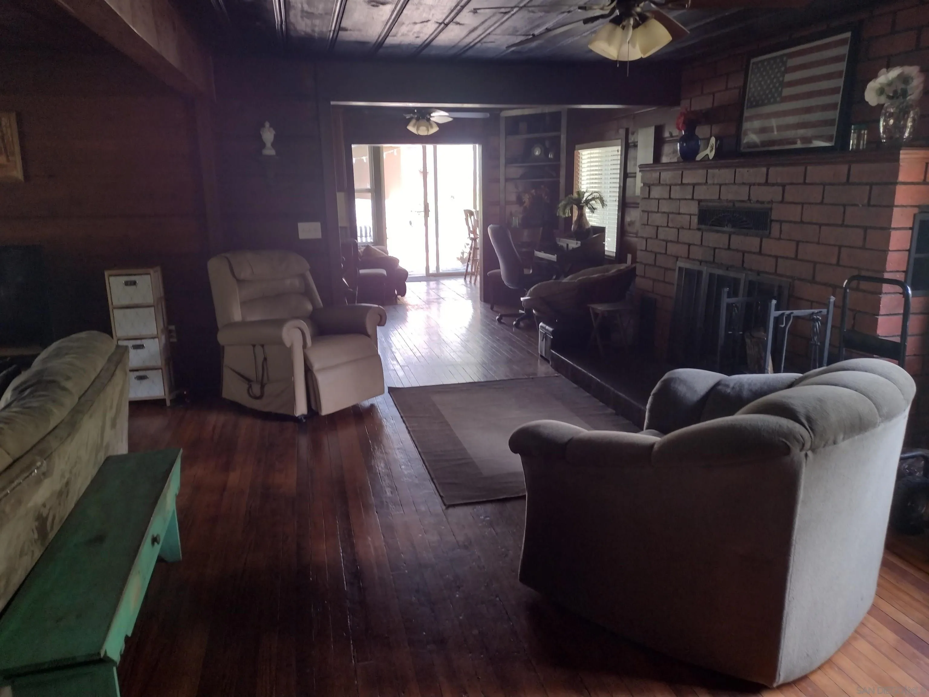17661 Lyons Valley Road Jamul, CA 91935 - Photo 30 of 50 a living room with furniture and wooden floor