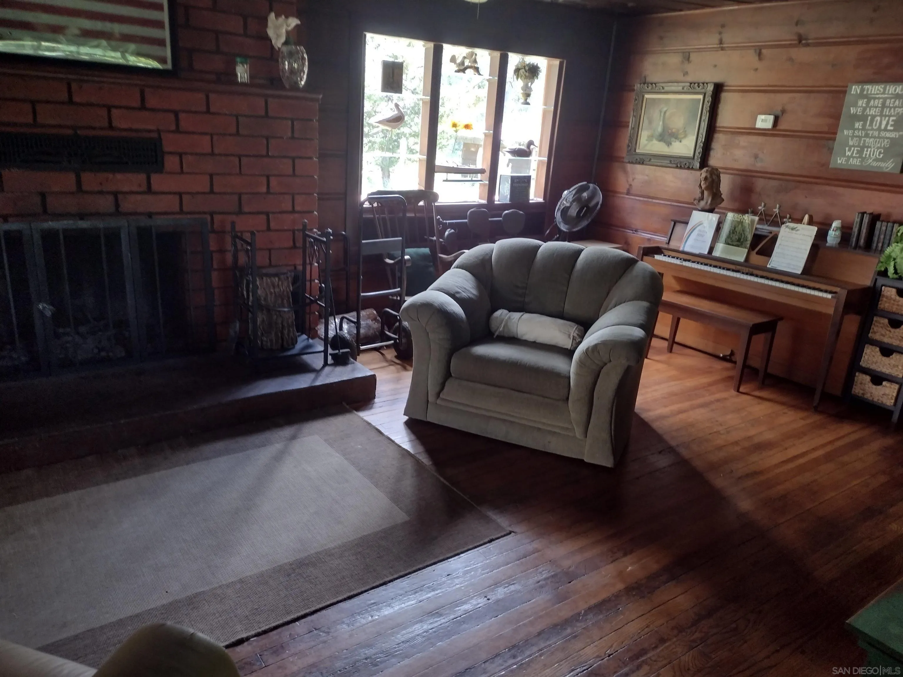 17661 Lyons Valley Road Jamul, CA 91935 - Photo 31 of 50 a living room with furniture and a fireplace