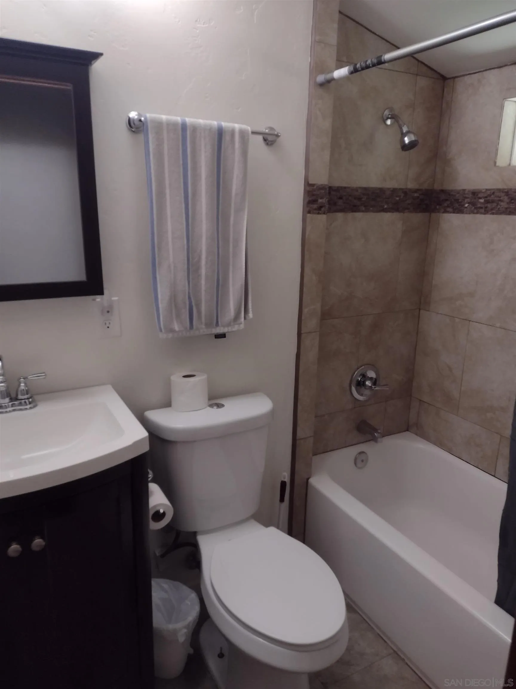 17661 Lyons Valley Road Jamul, CA 91935 - Photo 39 of 50 a bathroom with a sink mirror vanity and toilet
