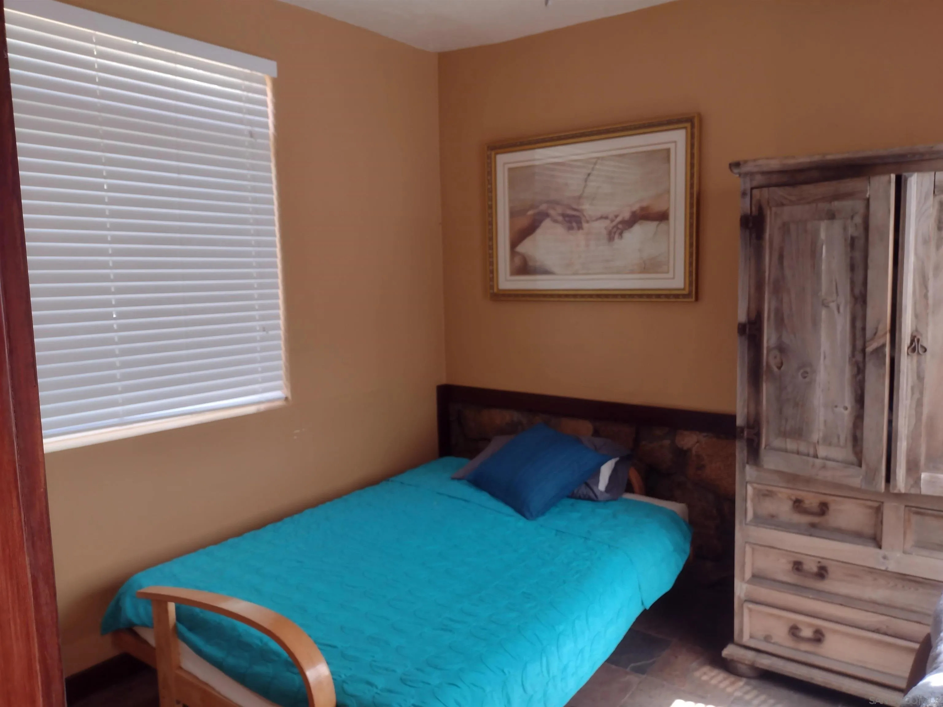 17661 Lyons Valley Road Jamul, CA 91935 - Photo 44 of 50 a bedroom with a bed and wooden floor