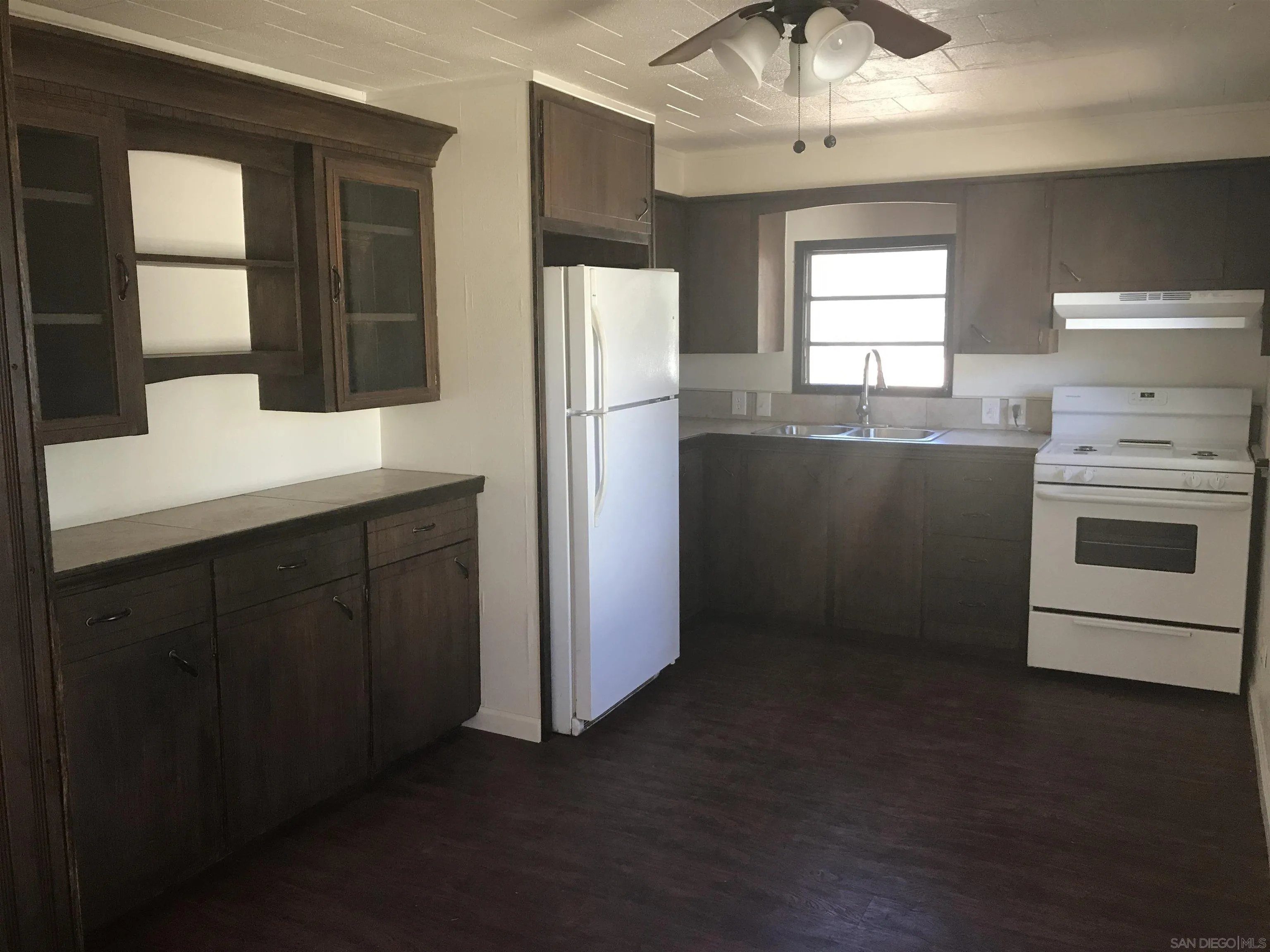 17661 Lyons Valley Road Jamul, CA 91935 - Photo 46 of 50 a kitchen with a refrigerator and window