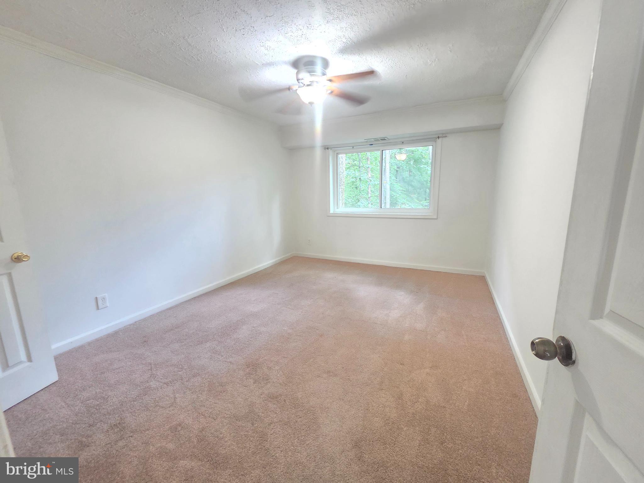 12658 Dara Drive, Unit 102 Woodbridge, VA 22192 - Photo 16 of 19 wooden floor in an empty room with a window