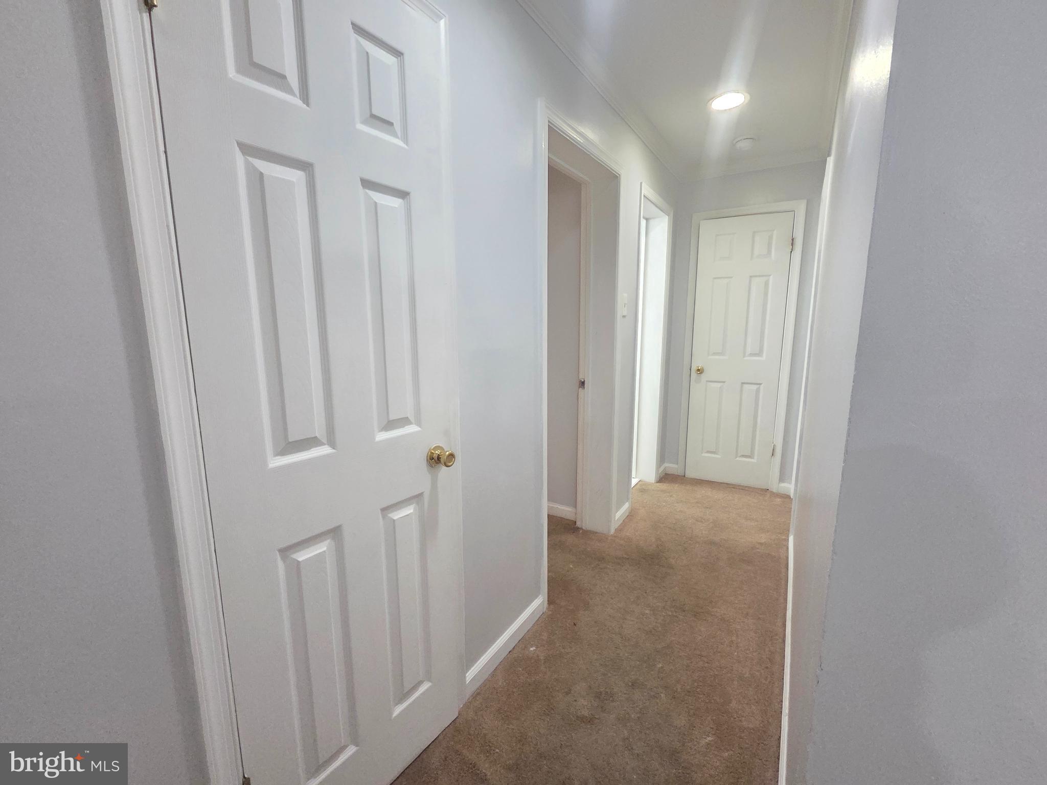 12658 Dara Drive, Unit 102 Woodbridge, VA 22192 - Photo 18 of 19 a view of a hallway with door