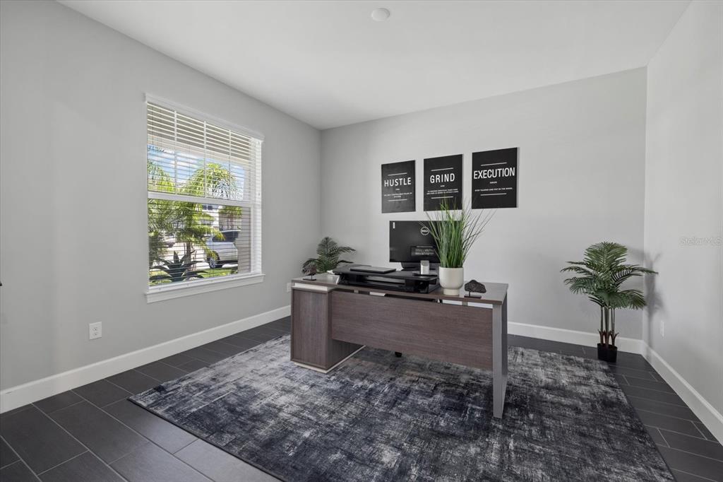 3508 Anchor Bay Trail Lakewood Ranch, FL 34211 - Photo 6 of 74 a view of a workspace with furniture and a window