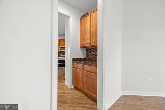 a view of a kitchen from the hallway